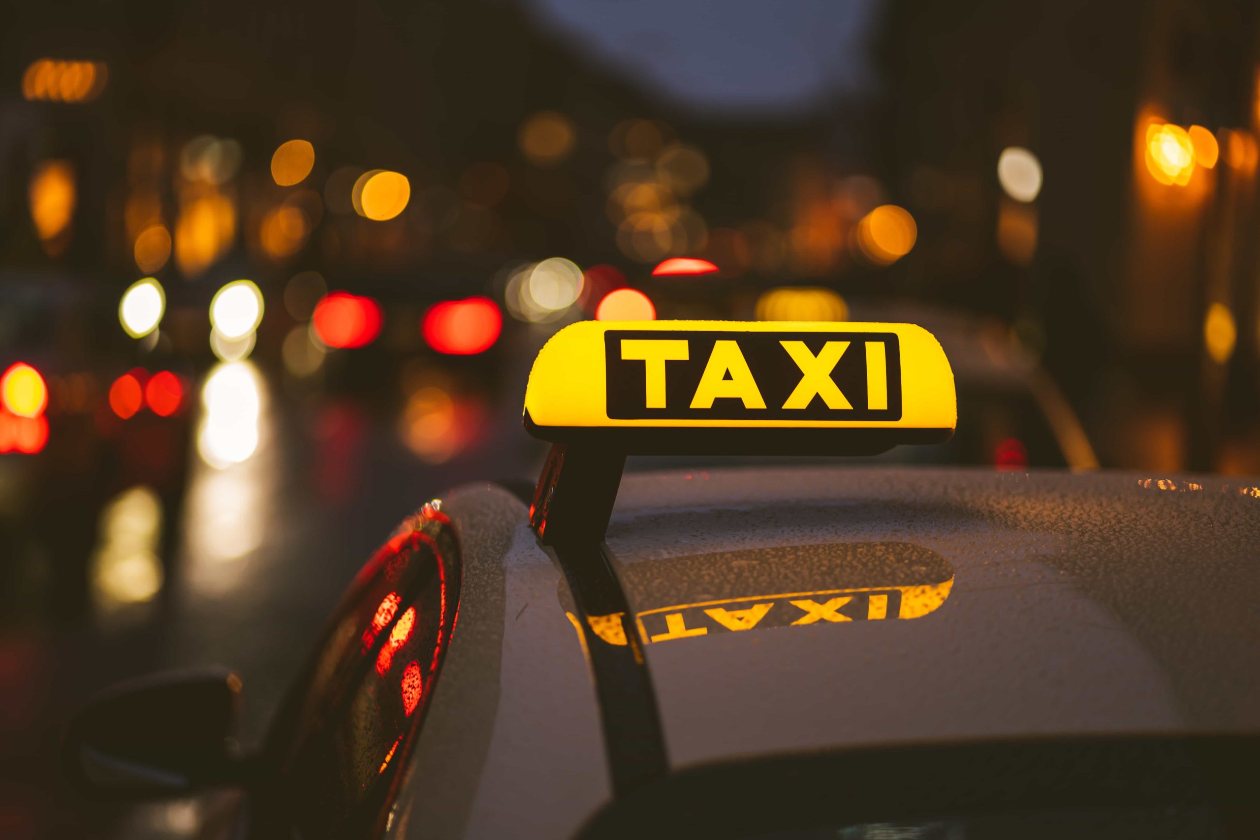 Taxi Latino Carxi taxi-sign-on-car-during-night